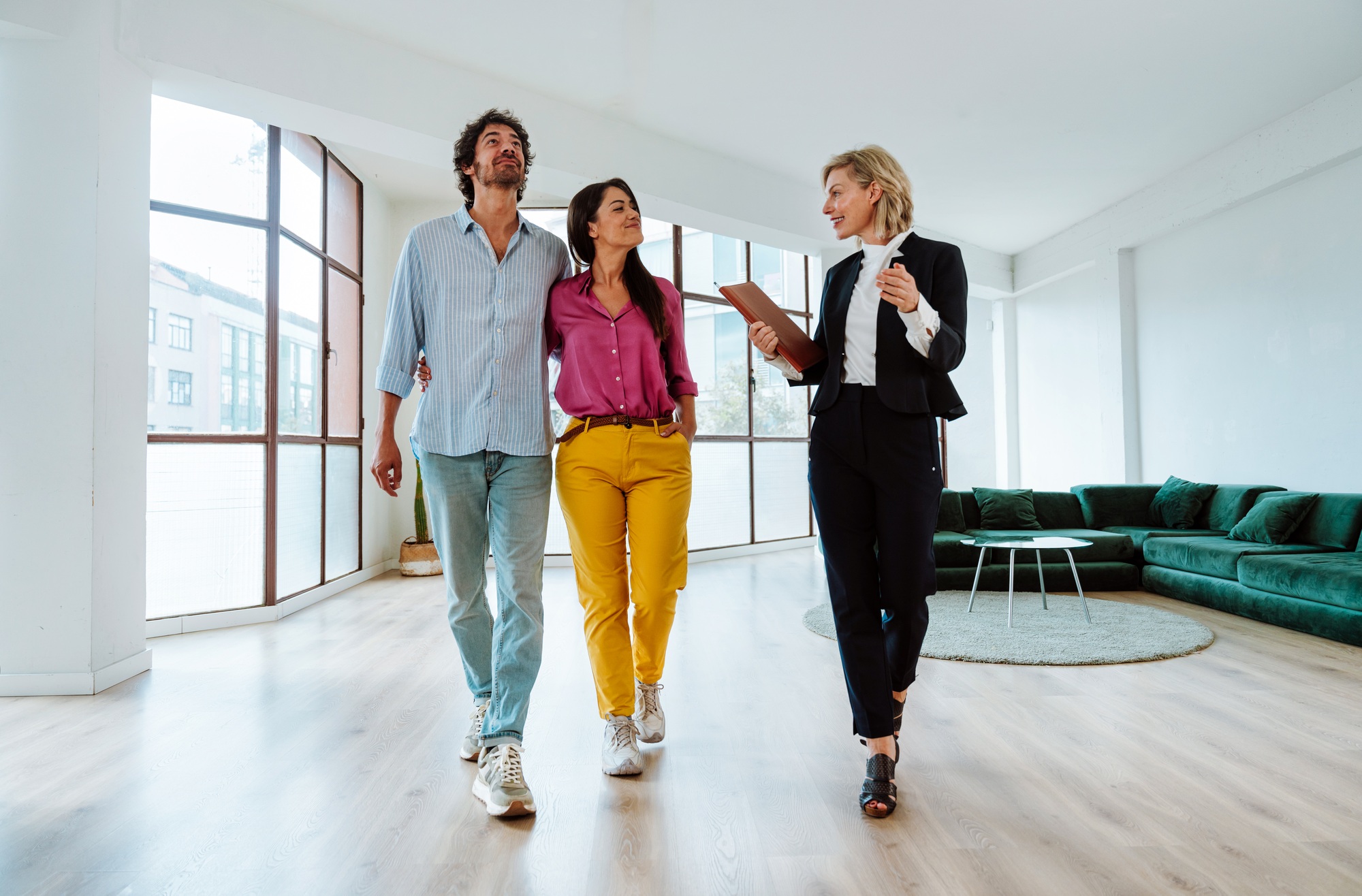 Real estate agent showing an apartment to a couple.